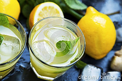 Fresh mojitos cocktails with lemons, fresh mint, ice cubes and s Stock Photo