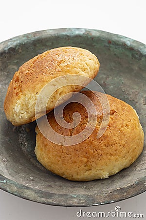 Fresh muffin in white background and old copper bowl Stock Photo