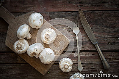 Fresh mushrooms on the wood plate Stock Photo