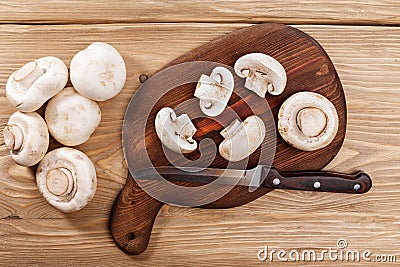 Fresh mushrooms on wooden cutboard Stock Photo