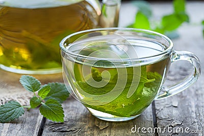 Fresh natural green melissa herbal tea in glass Stock Photo