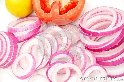 The fresh onion cutt roll with half tometo and lamon for great salled isolated in white background Stock Photo