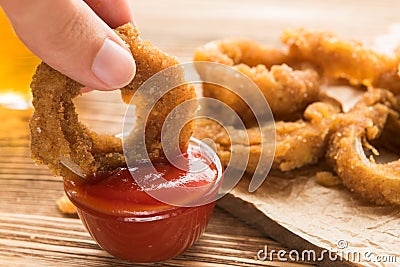 Fresh onion gings on a wooden board Stock Photo