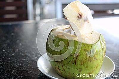 Fresh opened coconut drink Stock Photo