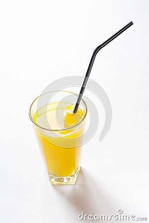 Fresh orange juice in glass with black tubule Stock Photo