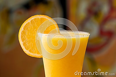 Fresh Orange Juice with raw slice served in disposable glass isolated on table top view of arabian food Stock Photo