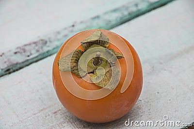 Fresh persimmon on a wooden background fruit Stock Photo