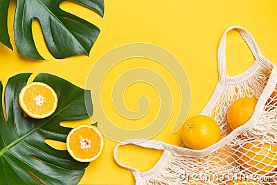 Fresh oranges in a eco bag. Cutted citrus fruit for healthly food. Stock Photo