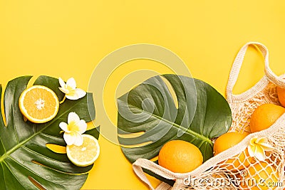 Fresh oranges in a eco bag. Cutted citrus fruit for healthly food. Stock Photo