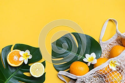 Fresh oranges in a eco bag. Cutted citrus fruit for healthly food. Stock Photo