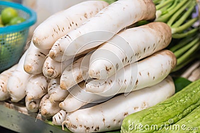 Fresh organic daikon radishes. Stock Photo