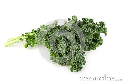 Fresh organic green kale leaves isolated over white background Stock Photo