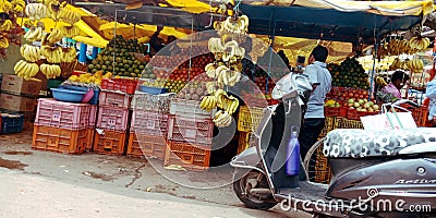 Fresh organic produce fruits hanging at street shop Editorial Stock Photo