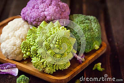 Fresh organic white and purple cauliflower, broccoli, romanesco Stock Photo