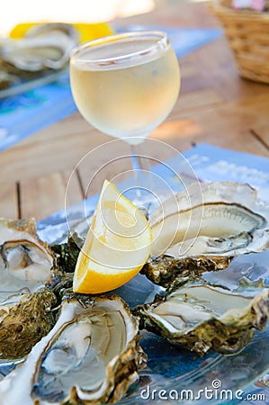 Fresh oysters and a glass of wine Stock Photo