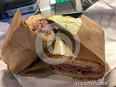 A fresh pastrami sandwhich with freshly pickeled cucumber Stock Photo