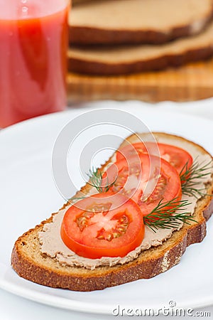 Fresh pate on bread with tomatoes Stock Photo