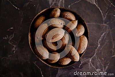 Fresh Pecan Nuts with husks Stock Photo