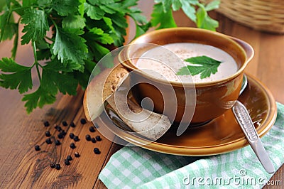 Fresh penny bun mushrooms soup with parsley herb Stock Photo