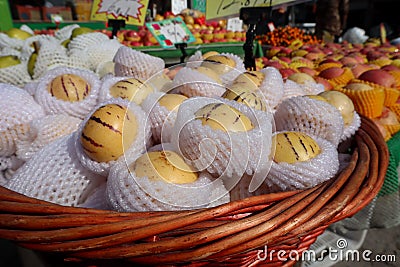 Fresh pepino fruit in wooden basket Stock Photo