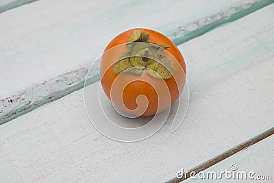 Fresh persimmon on a wooden background fruit Stock Photo