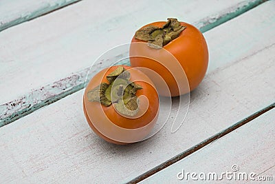 Fresh persimmon on a wooden background fruit Stock Photo