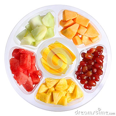 Fresh pieces of fruits in plastic container isolated on white Stock Photo