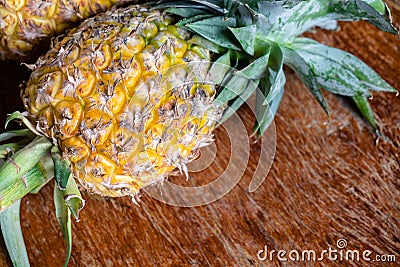 fresh pineapple on the rustic wood table Stock Photo