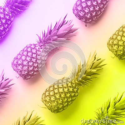 Fresh pineapples on vibrant rainbow gradient background. Top View. Pop art design, creative concept. Copy Space. Neon pineapple Stock Photo