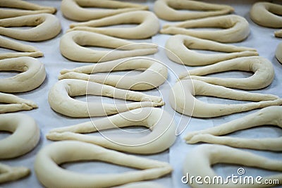 Fresh Pretzel or Brezel Dough on Wax Sheet Stock Photo