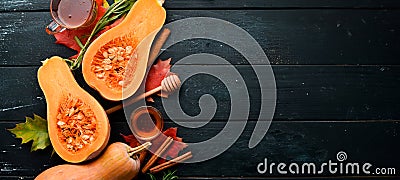 Fresh pumpkin with honey, healthy food. On a black stone background. Stock Photo