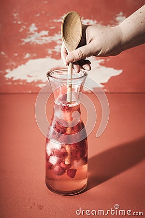 Fresh raspberry lemonade. Preparing cold summer drink Stock Photo