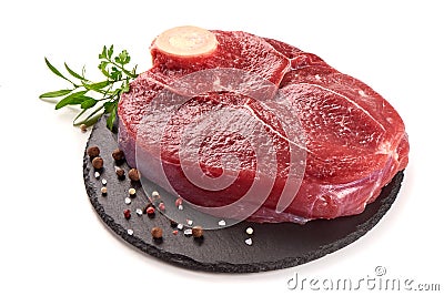 Fresh raw beef meat with bone for steak on stone plate, isolated on white background Stock Photo