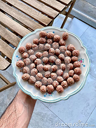 Fresh Raw Beef Small Mini Meatballs in Plate Holding with Hand Kofta or Kofte Stock Photo