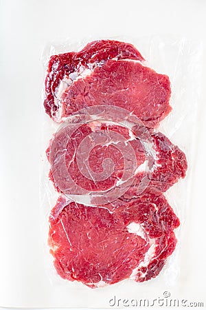 Fresh raw beef steaks in transparent vacuum packed Stock Photo