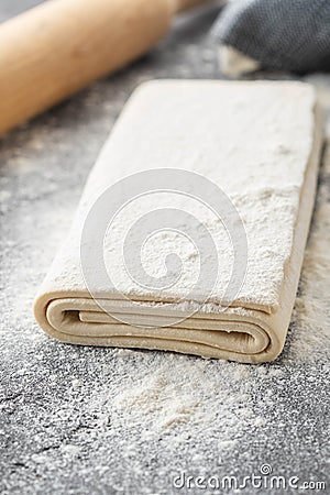 Fresh raw dough on table. Puff pastry. Copy space. Stock Photo