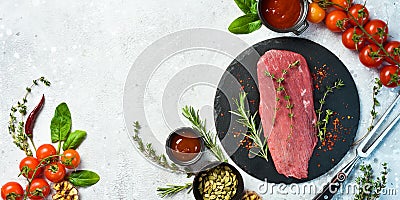 Fresh and raw fillet meat. Whole piece of beef tenderloin steaks set with spices and herbs. Meat. Stock Photo