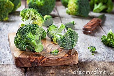 Fresh raw organic broccoli cutting board Stock Photo