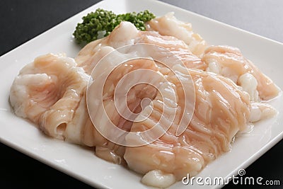 Fresh raw pig hormone stomach Intestine on white platter Stock Photo