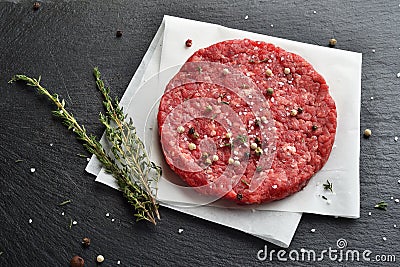 Fresh raw Prime Black Angus beef burger patty Stock Photo