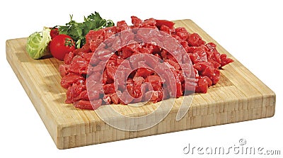 Fresh raw red cubed meat chunk on wooden cut board isolated over white background Stock Photo