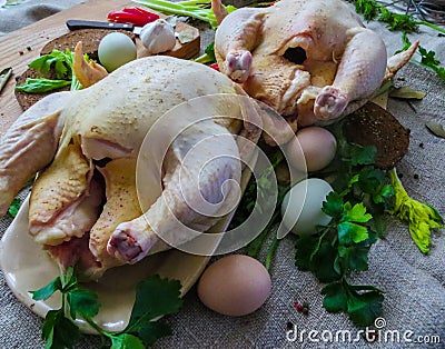 Fresh ,raw,rustic organic chickens prepared for baking in the oven Stock Photo