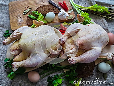 Fresh ,raw,rustic organic chickens prepared for baking in the oven Stock Photo