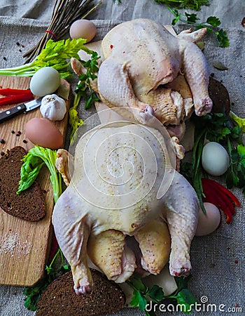 Fresh ,raw,rustic organic chickens prepared for baking in the oven Stock Photo