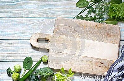 Fresh raw vegetables and empty cutting board food diet background concept Stock Photo