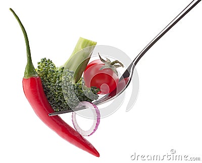 Fresh raw vegetables on fork isolated on white background cutout Stock Photo