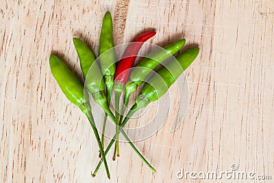 Fresh red and green chilli on old wood background. guinea pepper Stock Photo