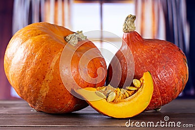 Fresh red kuri pumpkin hokkaido with curtains Stock Photo