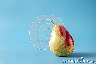 Fresh red pear on blue background, modern style fruit and vegetable food, design layout. Stock Photo