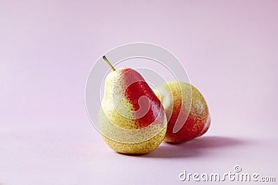 Fresh red pears on hipster pink background, modern style fruit and vegetable food, design layout. Stock Photo